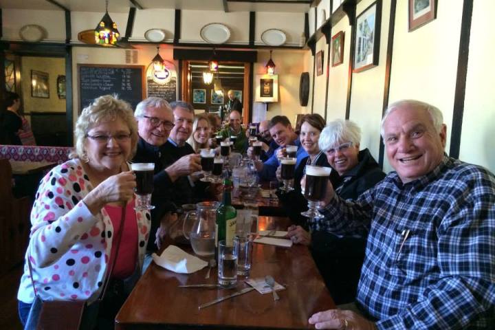 group toasting with beer